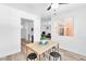 Bright dining area features a wood table, black stools, and a window providing natural light at 3151 Soaring Gulls Dr # 2136, Las Vegas, NV 89128