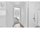 Bright hallway showing doorway to bedroom with wood floors and access to bath and shower at 3151 Soaring Gulls Dr # 2136, Las Vegas, NV 89128