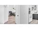 View of an open floor plan with hallway, living room, and kitchen at 3151 Soaring Gulls Dr # 2136, Las Vegas, NV 89128