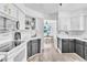 Well-lit kitchen with sleek black and white cabinets, stainless steel appliances, and modern countertops at 3151 Soaring Gulls Dr # 2136, Las Vegas, NV 89128