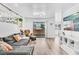 Bright and airy living room featuring a comfortable sofa, balcony access, and modern decor at 3151 Soaring Gulls Dr # 2136, Las Vegas, NV 89128