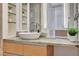 Contemporary bathroom showcases double vessel sinks, granite countertops, and decorative wall shelves at 3722 Las Vegas Blvd # 2204, Las Vegas, NV 89158