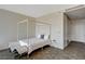 Neutral bedroom boasts a minimalist four-poster bed, tiled floors, and serene, uncluttered design at 3722 Las Vegas Blvd # 2204, Las Vegas, NV 89158