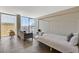 Modern bedroom showcasing a sleek four-poster bed, comfortable seating, and expansive city views at 3722 Las Vegas Blvd # 2204, Las Vegas, NV 89158