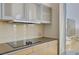 Modern kitchen featuring sleek countertops and built-in cooktop with city views at 3722 Las Vegas Blvd # 2204, Las Vegas, NV 89158