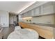 Well-lit kitchen featuring a marble table, stainless steel appliances, and sleek countertops at 3722 Las Vegas Blvd # 2204, Las Vegas, NV 89158