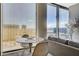 Modern living area featuring a dining table with city views at 3722 Las Vegas Blvd # 2204, Las Vegas, NV 89158