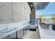 Outdoor kitchen featuring stainless steel cabinets, a sink, and a grill area at 3722 Las Vegas Blvd # 2204, Las Vegas, NV 89158