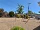 This cozy home offers a spacious gravel backyard, ideal for entertaining, complete with mature landscaping at 4420 Avondale Ave, Las Vegas, NV 89121