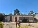 This cozy home offers a spacious gravel backyard, ideal for entertaining, complete with mature landscaping at 4420 Avondale Ave, Las Vegas, NV 89121