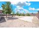 Expansive backyard featuring desert landscaping, block fencing and a fresh concrete slab, ideal for customization at 45 Prince Ln, Las Vegas, NV 89110