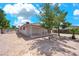 Large backyard featuring desert landscaping, mature trees and a covered patio, perfect for outdoor living and relaxation at 45 Prince Ln, Las Vegas, NV 89110