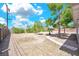 Spacious backyard with desert landscaping and a stone walkway, offering a blank canvas for personalization at 45 Prince Ln, Las Vegas, NV 89110