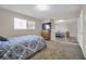 Neutral toned bedroom featuring a window, TV, dresser, closet with mirrored doors, and comfortable carpet at 45 Prince Ln, Las Vegas, NV 89110