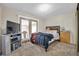 Relaxing bedroom featuring cozy carpet, a ceiling fan, and easy access to the balcony at 45 Prince Ln, Las Vegas, NV 89110