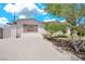 Inviting single-story home with mature landscaping and a spacious driveway at 45 Prince Ln, Las Vegas, NV 89110