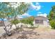 Lovely single-story home with mature landscaping, a secured window, and desert landscaping at 45 Prince Ln, Las Vegas, NV 89110