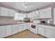 Classic kitchen with white appliances, ample cabinet space, and tiled backsplash for a clean look at 45 Prince Ln, Las Vegas, NV 89110