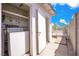 Covered outdoor laundry area with a washer and dryer, offering convenience and functionality at 45 Prince Ln, Las Vegas, NV 89110
