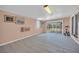 Spacious bonus room with tiled floors, a sliding glass door, and peach colored walls at 45 Prince Ln, Las Vegas, NV 89110