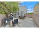 Spacious back patio with seating, dining furniture, and privacy walls at 4820 Integrity St, North Las Vegas, NV 89031