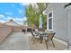 Large back patio with ample seating, a dining table, and a shade umbrella at 4820 Integrity St, North Las Vegas, NV 89031
