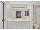 Bathroom featuring dual sinks, a large mirror, and a well-lit vanity area at 4820 Integrity St, North Las Vegas, NV 89031