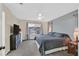 Bedroom features a plush carpet, ceiling fan, and a window overlooking the neighborhood at 4820 Integrity St, North Las Vegas, NV 89031