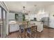 Open dining area adjacent to the kitchen, featuring a modern chandelier and easy access to the patio at 4820 Integrity St, North Las Vegas, NV 89031