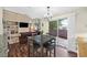 Cozy dining area with access to backyard, features an elegant chandelier, and open to the living room at 4820 Integrity St, North Las Vegas, NV 89031