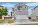 Inviting two-story home featuring a neutral color palette, two-car garage and low maintenance landscaping at 4820 Integrity St, North Las Vegas, NV 89031