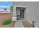 Charming front entrance with stone accents, well-maintained landscaping, and a secure screen door at 4820 Integrity St, North Las Vegas, NV 89031
