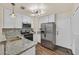Modern kitchen with stainless steel appliances, granite countertops, and updated cabinetry at 4820 Integrity St, North Las Vegas, NV 89031