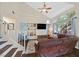 Inviting living room with large window, vaulted ceilings, hardwood floors, and comfortable seating at 4820 Integrity St, North Las Vegas, NV 89031
