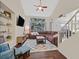 Spacious living room with lots of natural light, hardwood floors and comfortable leather sectional at 4820 Integrity St, North Las Vegas, NV 89031