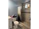 Bright bathroom featuring a tiled shower, updated fixtures, and ample natural light, creating a serene and functional space at 4834 E Van Buren Ave, Las Vegas, NV 89110