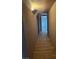 Hallway features wood-look tile flooring and neutral paint and leads to other rooms at 4834 E Van Buren Ave, Las Vegas, NV 89110