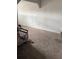 Cozy carpeted living room space, offering comfort and versatility for furniture arrangement and relaxation at 4834 E Van Buren Ave, Las Vegas, NV 89110