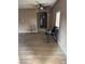 Open-concept living room features tile floors, neutral paint, and a ceiling fan, providing a comfortable living space at 4834 E Van Buren Ave, Las Vegas, NV 89110