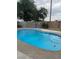Backyard featuring a refreshing in-ground pool perfect for relaxing and entertaining at 4834 E Van Buren Ave, Las Vegas, NV 89110