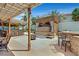 Backyard paradise features a full bar, covered spa, a fire pit, and custom concrete work at 603 Fiddlehead Ave, Las Vegas, NV 89183