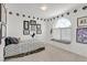 Bedroom with neutral colored walls and carpet and a small window with window bench seat at 603 Fiddlehead Ave, Las Vegas, NV 89183