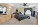 Comfortable bedroom with neutral carpet, ceiling fan, and decorative accents offers a relaxing retreat at 603 Fiddlehead Ave, Las Vegas, NV 89183