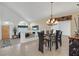 Elegant dining room with a glass-top table, modern chairs, and an open layout at 603 Fiddlehead Ave, Las Vegas, NV 89183