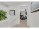 A hallway with stairs leads to a bedroom, providing a glimpse of the bed and window at 603 Fiddlehead Ave, Las Vegas, NV 89183