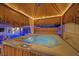 Private hot tub nestled under a tiki hut, offering a serene retreat for relaxation and rejuvenation at 603 Fiddlehead Ave, Las Vegas, NV 89183