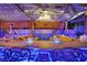 Beautiful outdoor bar area with tropical-themed decor and lighting, perfect for entertaining and relaxation at 603 Fiddlehead Ave, Las Vegas, NV 89183