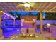 Inviting backyard area featuring tiki decor, comfortable seating, and ambient lighting for a relaxing outdoor experience at 603 Fiddlehead Ave, Las Vegas, NV 89183