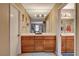 Bathroom with a large vanity with double sinks, tile countertops, a bathtub and walk-in shower at 611 Spyglass Ln, Las Vegas, NV 89107