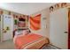 A cozy bedroom with unique decor, a comfortable bed, and plenty of personality at 611 Spyglass Ln, Las Vegas, NV 89107